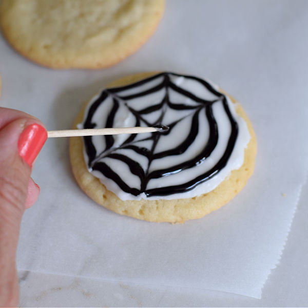 making spider web cookies for Halloween 