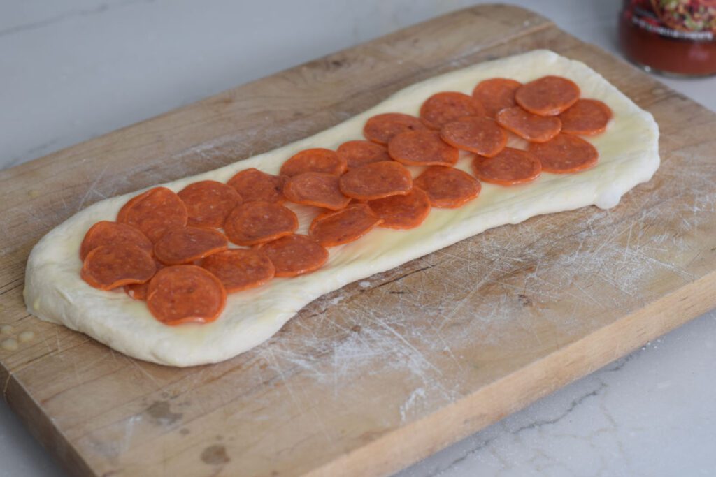 pepperoni on bread dough 