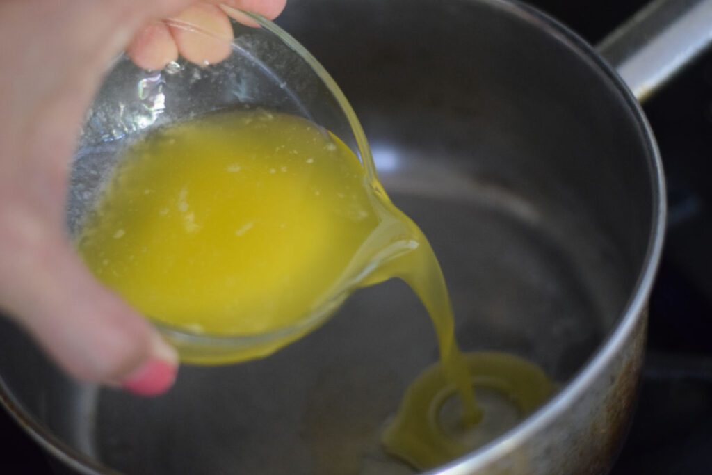 adding melted butter to sauce pan for spinach maria recipe