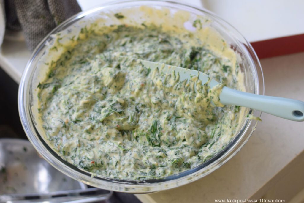 folding in spinach for spinach maria